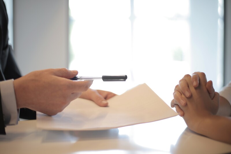 crop businessman giving contract to woman to sign 3760067 v2